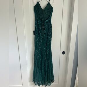 Dark green Lulu’s backless prom dress with lace up straps and sequin detailing